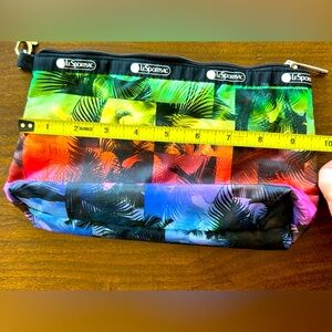 LeSportsac pouch with detachable wrist strap can use as clutch. New. No tags